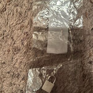 Silver earrings and locket necklace. Brand new.